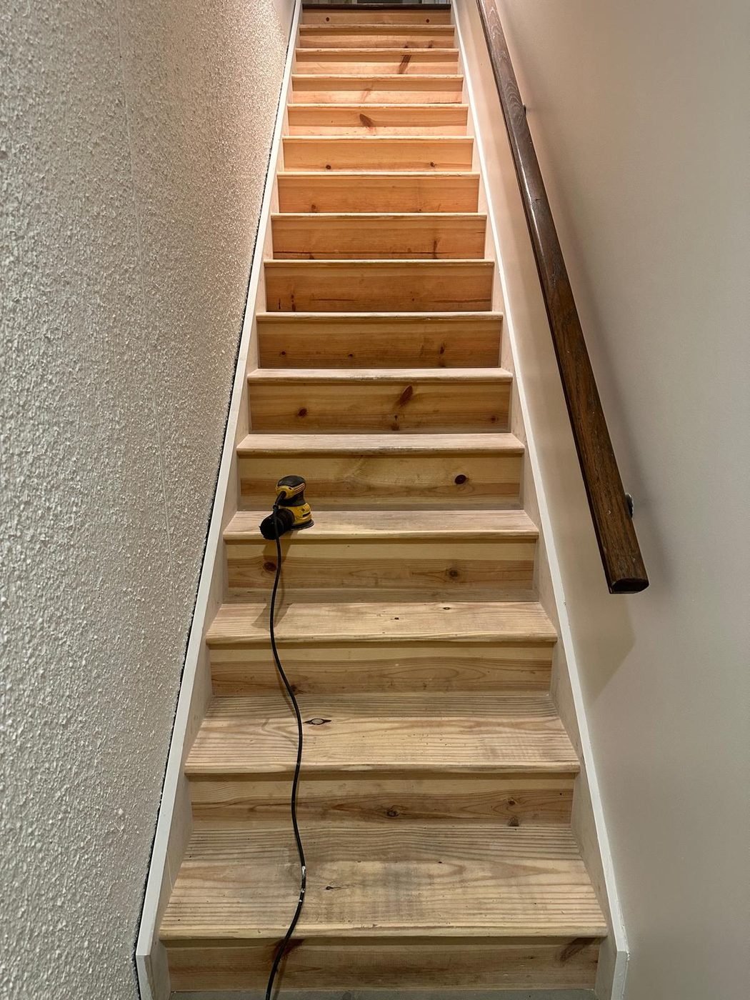 Sanded and refinished wooden staircase