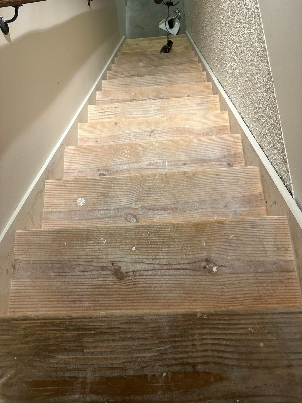 Worn wooden staircase before refinishing